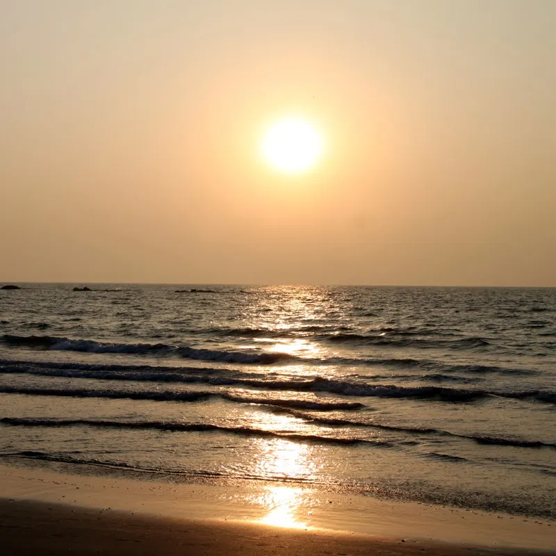 Very scenic sunset by the beach. Reflection of the sun in waters is wonderful and so are the colors of the sky